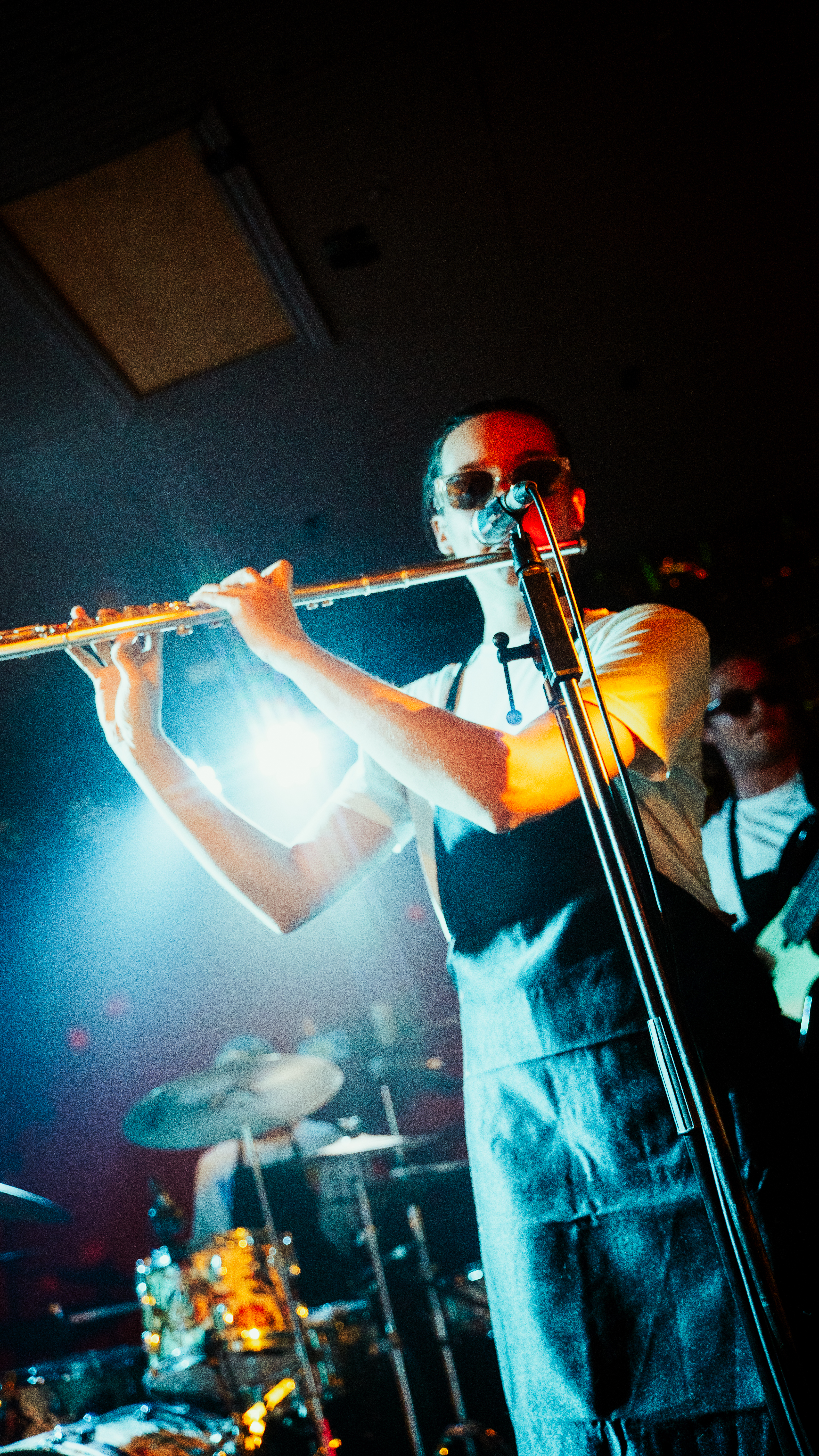 Musician playing flute during a live performance